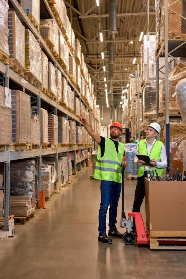 Caucasian,Warehouse,Managers,Walking,Through,Large,Warehouse,Distribution,Center,Discussing Caucasian,Warehouse,Managers,Walking,Through,Large,Warehouse,Distribution,Center,Discussing