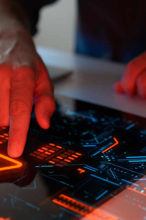 Man,Interacting,With,A,Holographic,Touchscreen,Interface,In,Red,Color. Man,Interacting,With,A,Holographic,Touchscreen,Interface,In,Red,Color.