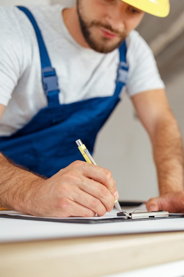 Close,Up,Of,Hands,Of,Repairman,Writing,Down,Details,Of Close,Up,Of,Hands,Of,Repairman,Writing,Down,Details,Of